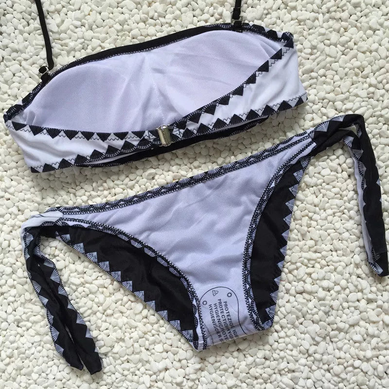 Women's strapless bikini set with tie-side bottoms in durable polyester-nylon blend.