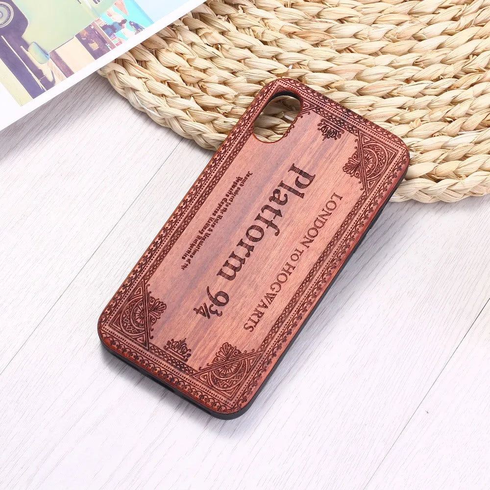 Wooden iPhone case with laser-carved floral design and flexible TPU bumper in natural wood finish.