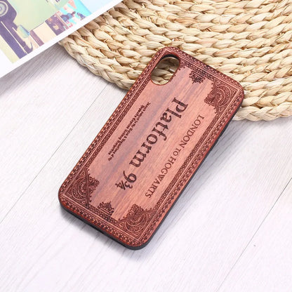 Wooden iPhone case with laser-carved floral design and flexible TPU bumper in natural wood finish.