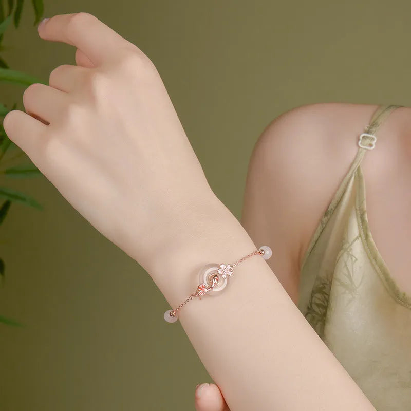 Women's S925 sterling silver bracelet with white chalcedony flowers and geometric koi fish charm