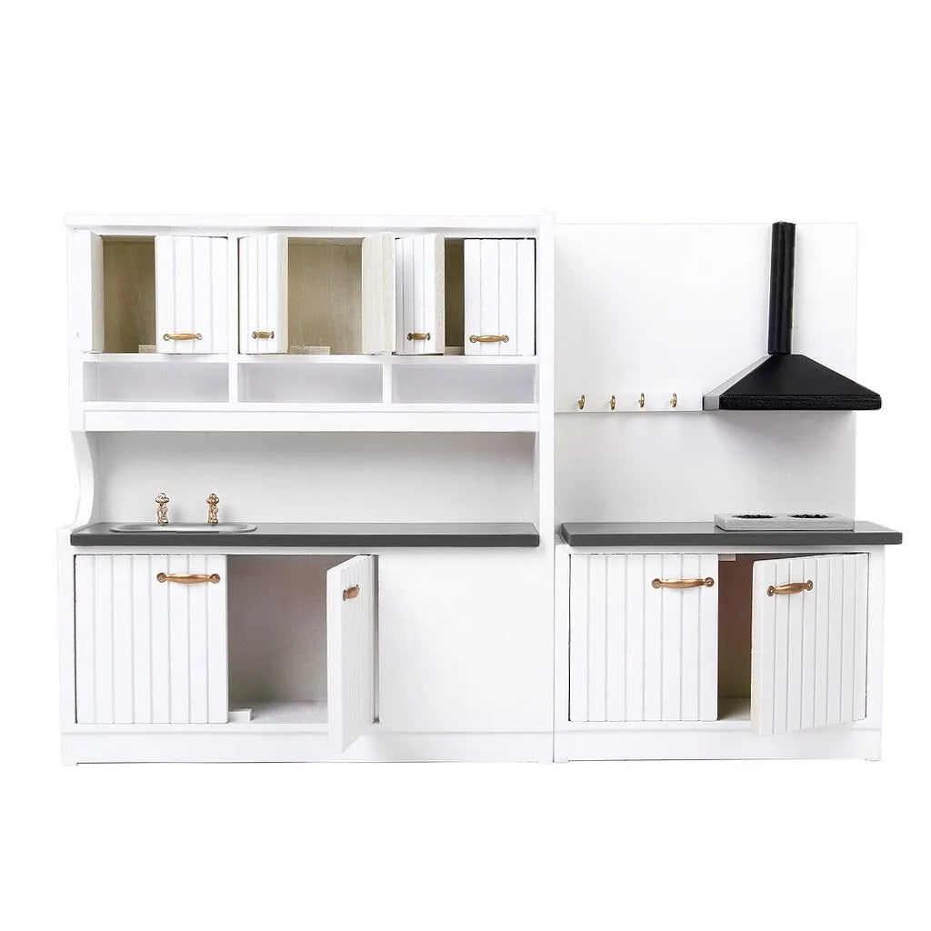 White dollhouse kitchen sink and stove cabinets with working doors and metal handles.