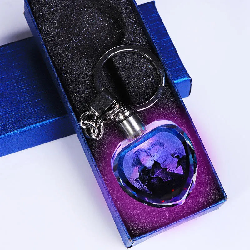 Custom laser-etched crystal photo keychain with internal colourful LED light activated, showing a personalised image.