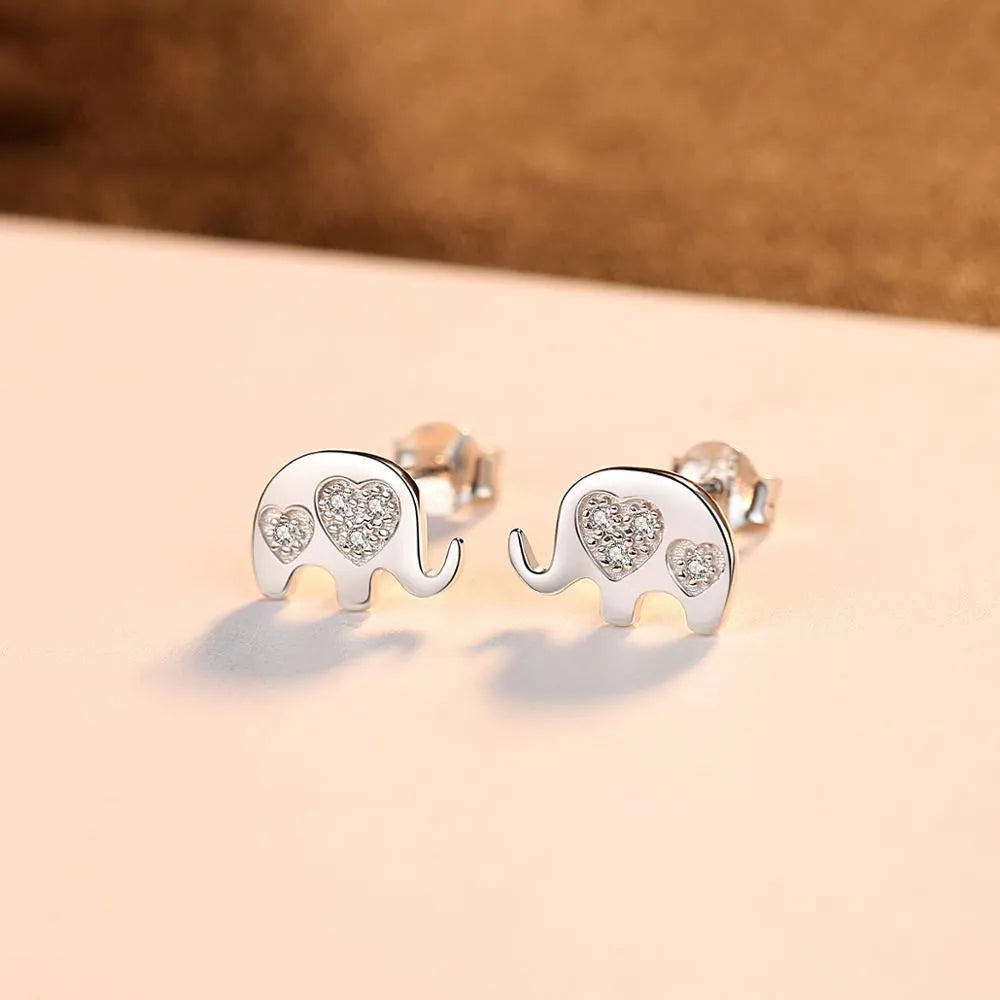 Silver geometric drop earrings measuring 0.6cm by 0.9cm with gem setting detailing