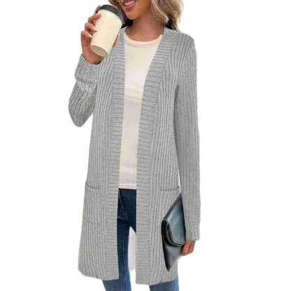Long sleeve loose fit knitted cardigan jacket with side pockets, shown in grey.