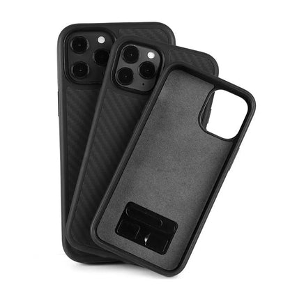 Black solid colour wooden iPhone case with TPU and Kevlar construction on a table.