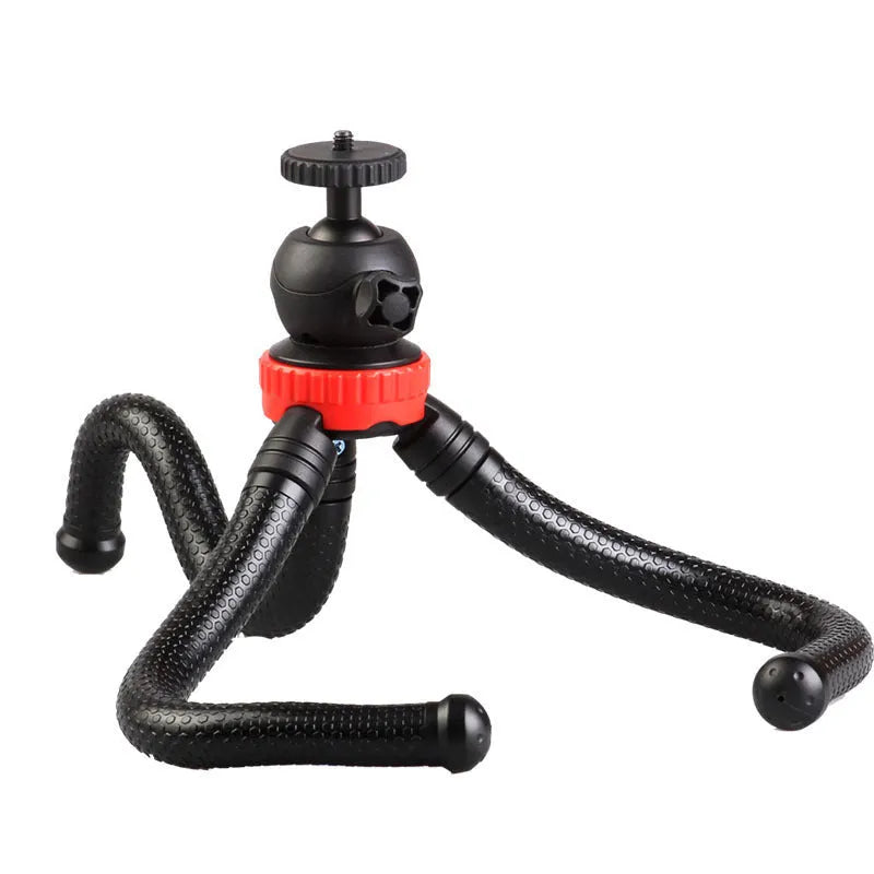 Black octopus tripod with flexible rubber legs wrapped around a pole, holding a smartphone.