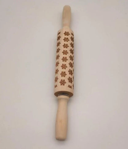 Festive rolling pin with embossed Christmas designs for easy imprinting on dough