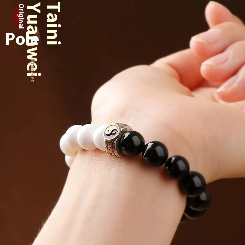 Black and white Tai Chi bracelet with obsidian beads and six-word mantra in geometric pattern