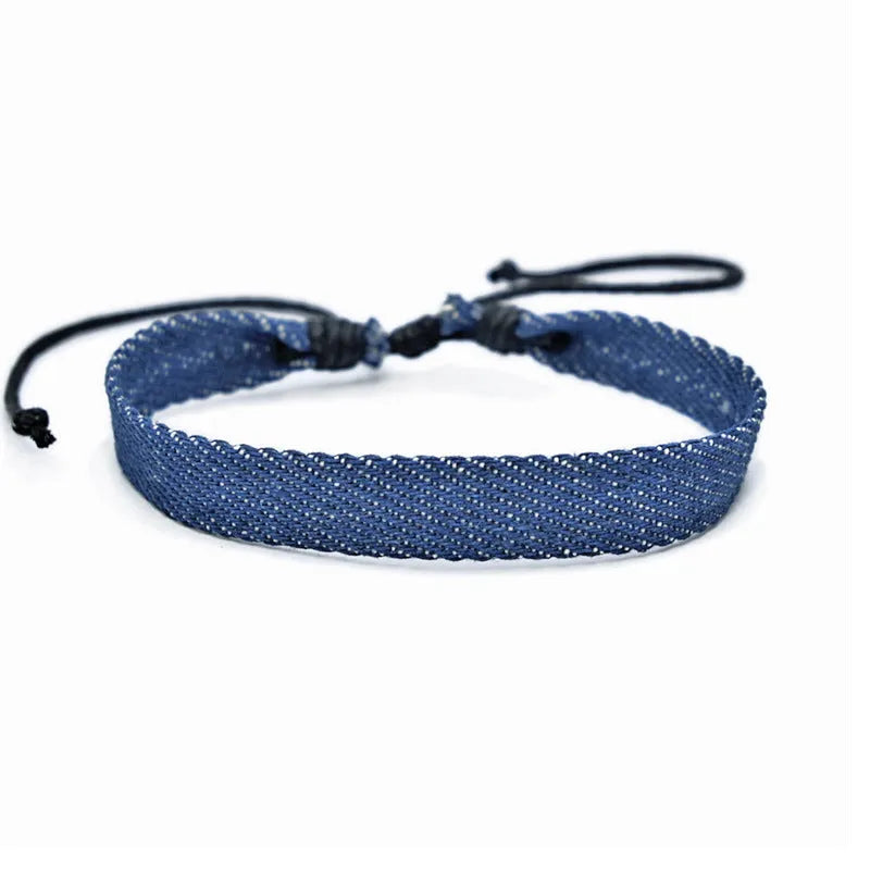 National style denim fabric bracelet carrying strap showing mixed material construction and wristband design