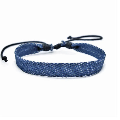 National style denim fabric bracelet carrying strap showing mixed material construction and wristband design