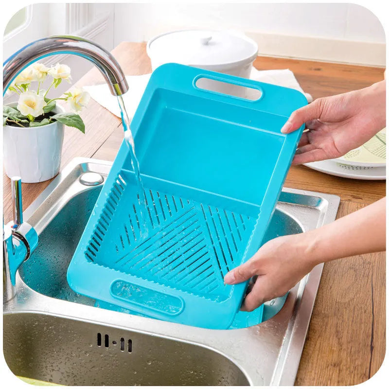Blue multifunction kitchen chopping board with integrated sink drain basket and TPE handle.