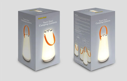 White rechargeable LED lantern with USB cable on a bedside table.