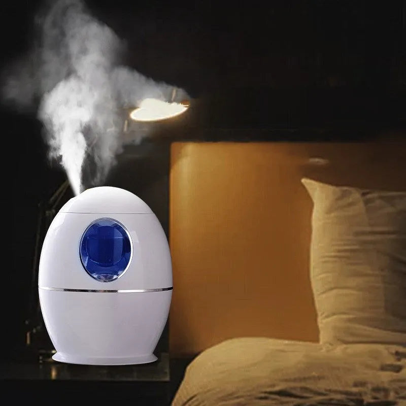 White columnar air disinfection humidifier with USB cable on wooden surface