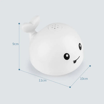 Grey or white electric whale bath toy spraying water with LED lights on a base.