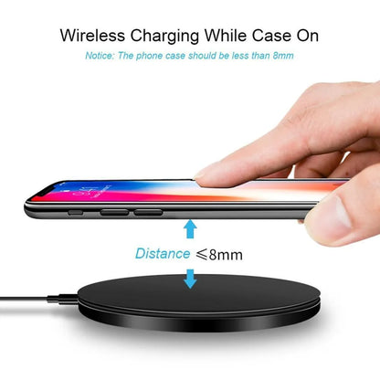 Black ultra-thin square wireless fast charging pad for phones on a desk