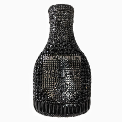 Gold hard-shell clutch bag shaped like a champagne bottle with a synthetic leather interior.