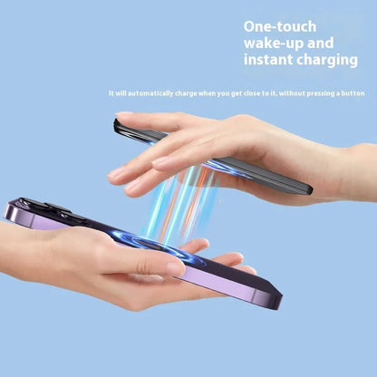 Slim dark grey magnetic power bank attached to the back of an iPhone, showing its thin profile and metallic finish.