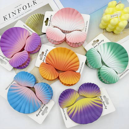 Gradient frosted plastic hair clip set in three pieces with shell decoration