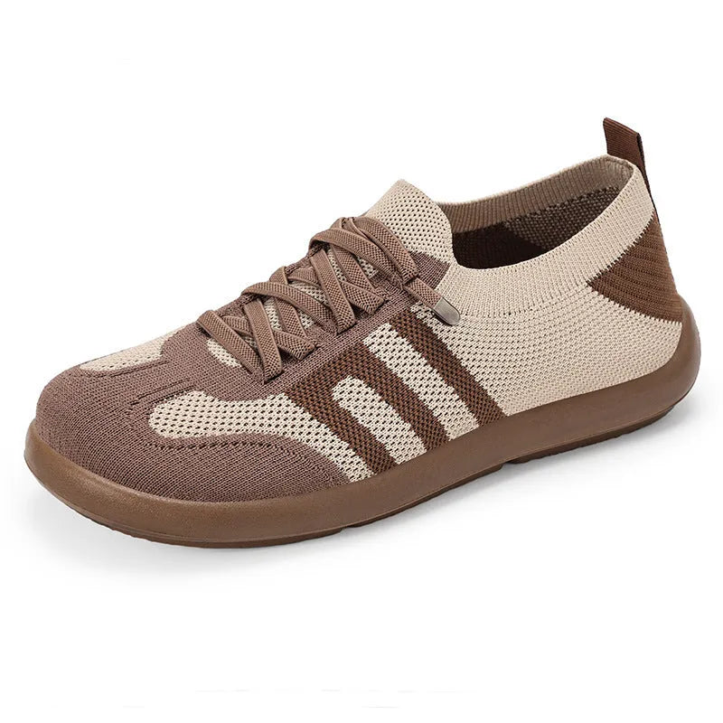 Retro style casual training shoes in flyknit mesh with a soft PU sole and flat heel.