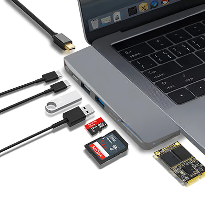 Silver 8-in-1 USB-C card reader hub for MacBook Pro with multiple ports including USB and SD slots.