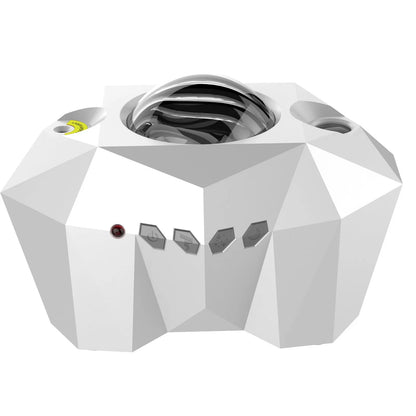 Black and white LED Dream Aurora Borealis light projector with remote control on a table