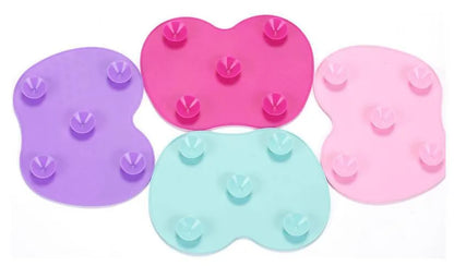 Silicone makeup brush cleaning pad, 15.5 x 12 cm, shown as a coloured brush cleaner mat for cleansing makeup brushes.