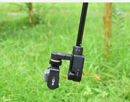 Black retractable selfie stick extended to 100cm with phone attached and Bluetooth remote