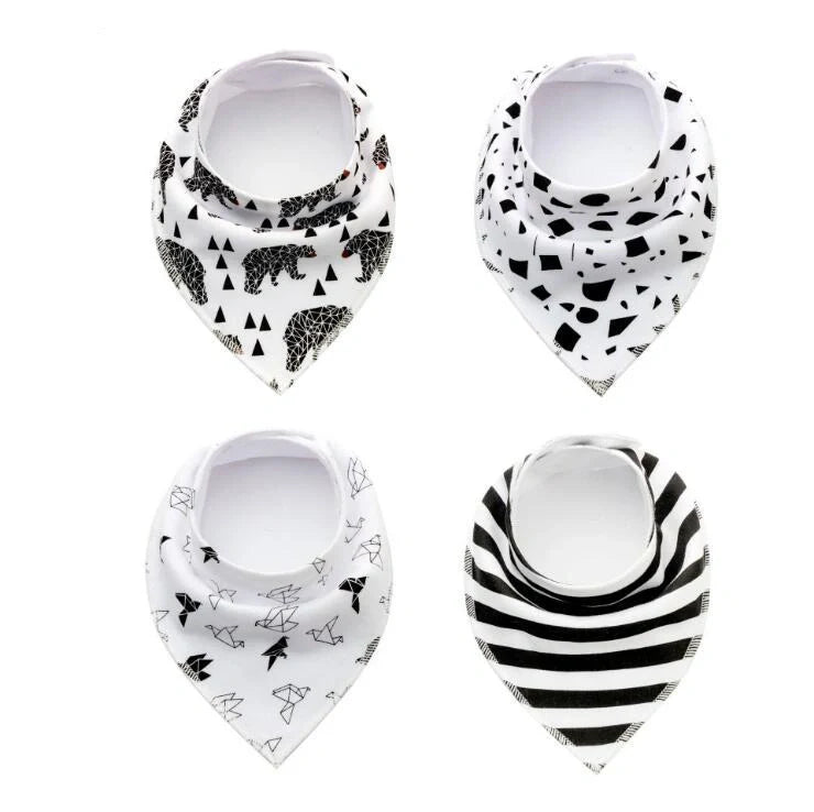 Set of four cotton baby bibs with arrow and wave designs for mess-free feeding