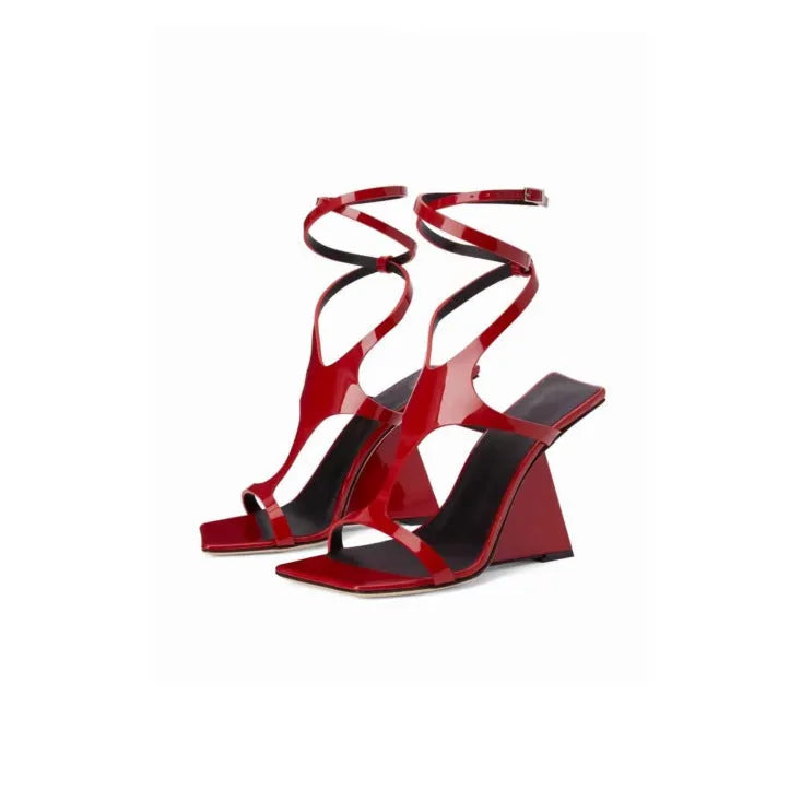 Black women's high heel sandals with a square toe and buckle strap, shown on a white background.