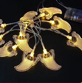Halloween LED string lights with bat, ghost, and pumpkin pendants on a 1.2 metre white cable.