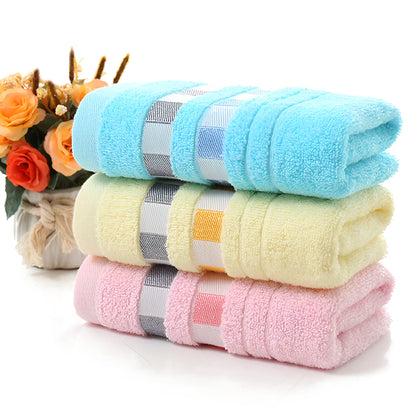 Cotton face towel in blue, pink and yellow colours with heart patterns, dimensions 73x33cm