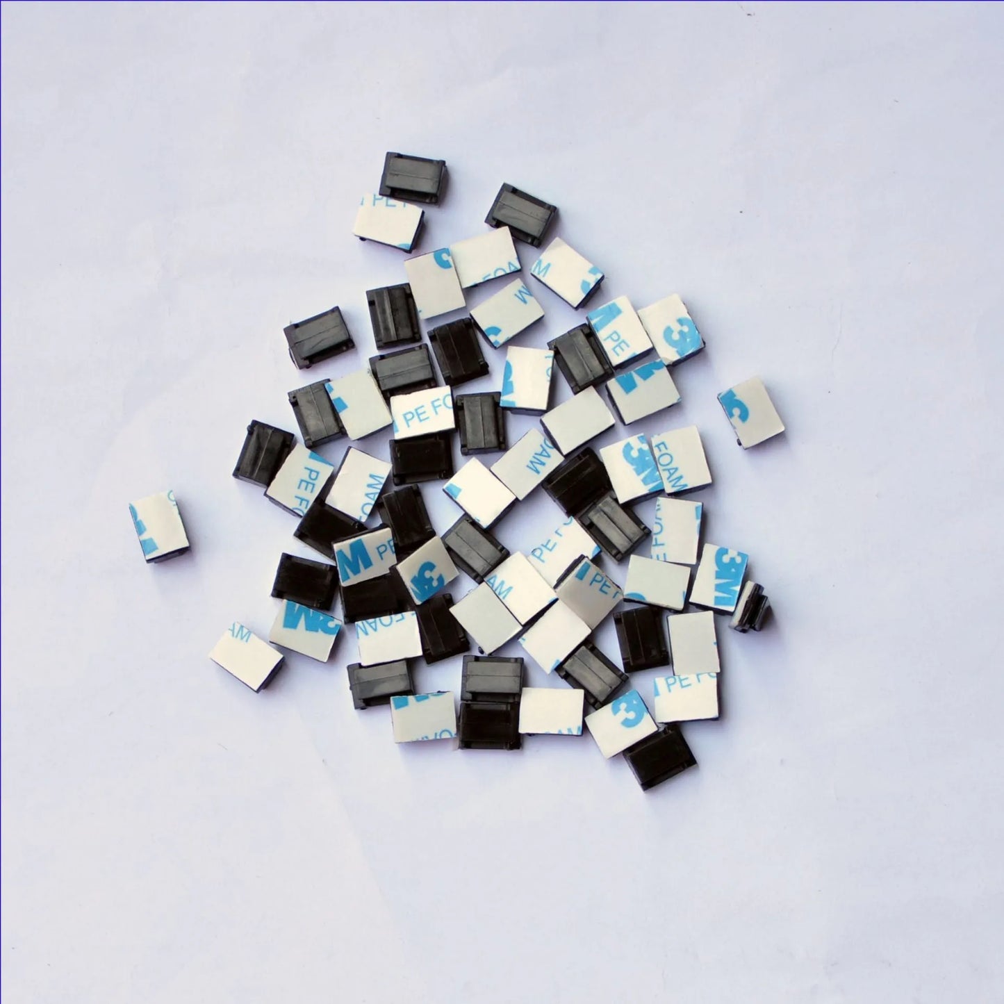 Black PA66 nylon car wire retaining clip for managing automotive and LED electronic cables.