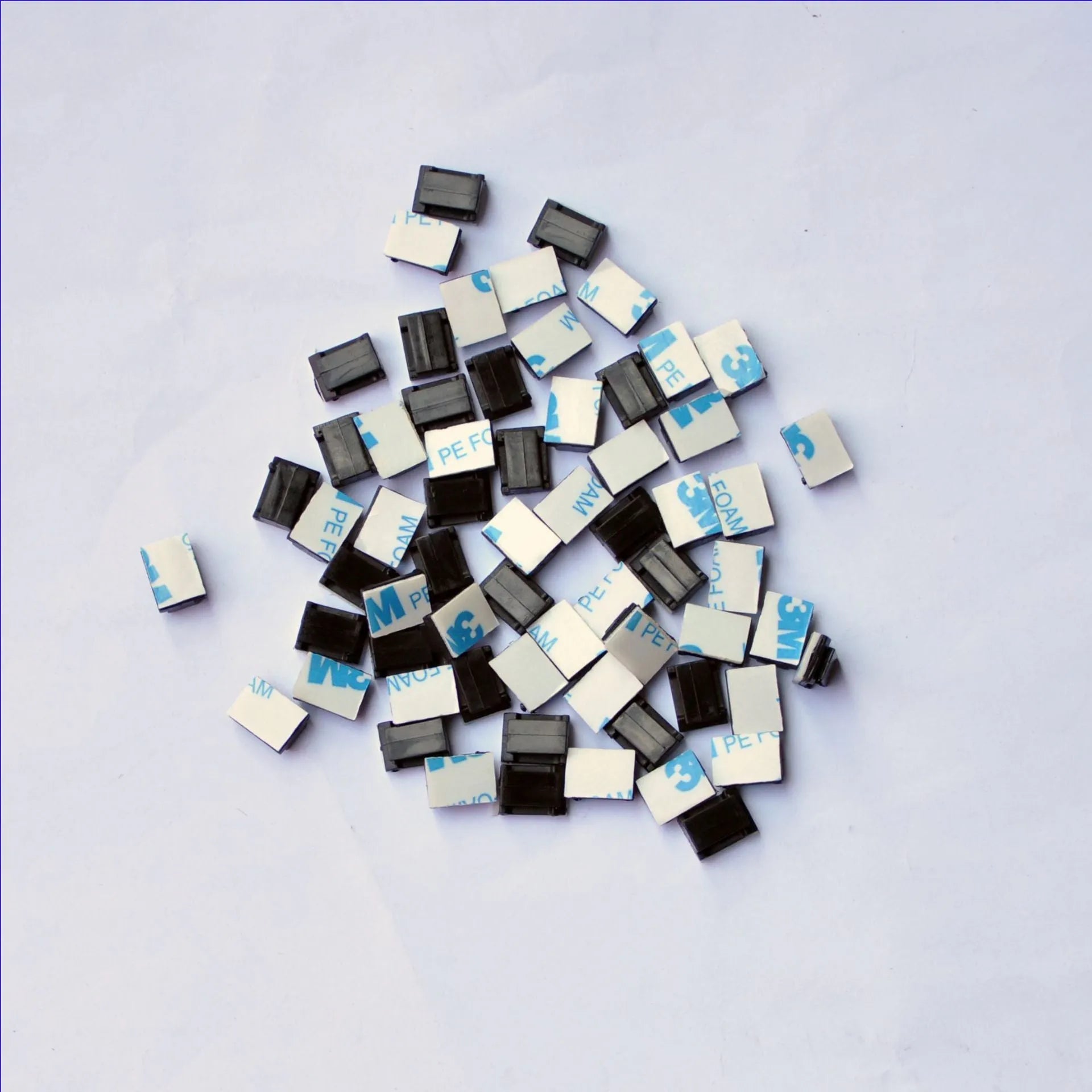 Black PA66 nylon car wire retaining clip for managing automotive and LED electronic cables.