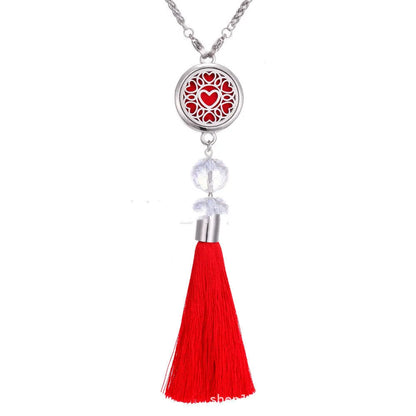 Alloy car aromatherapy pendant with tassel on 50cm chain beside coloured cotton pads for fragrance diffusion