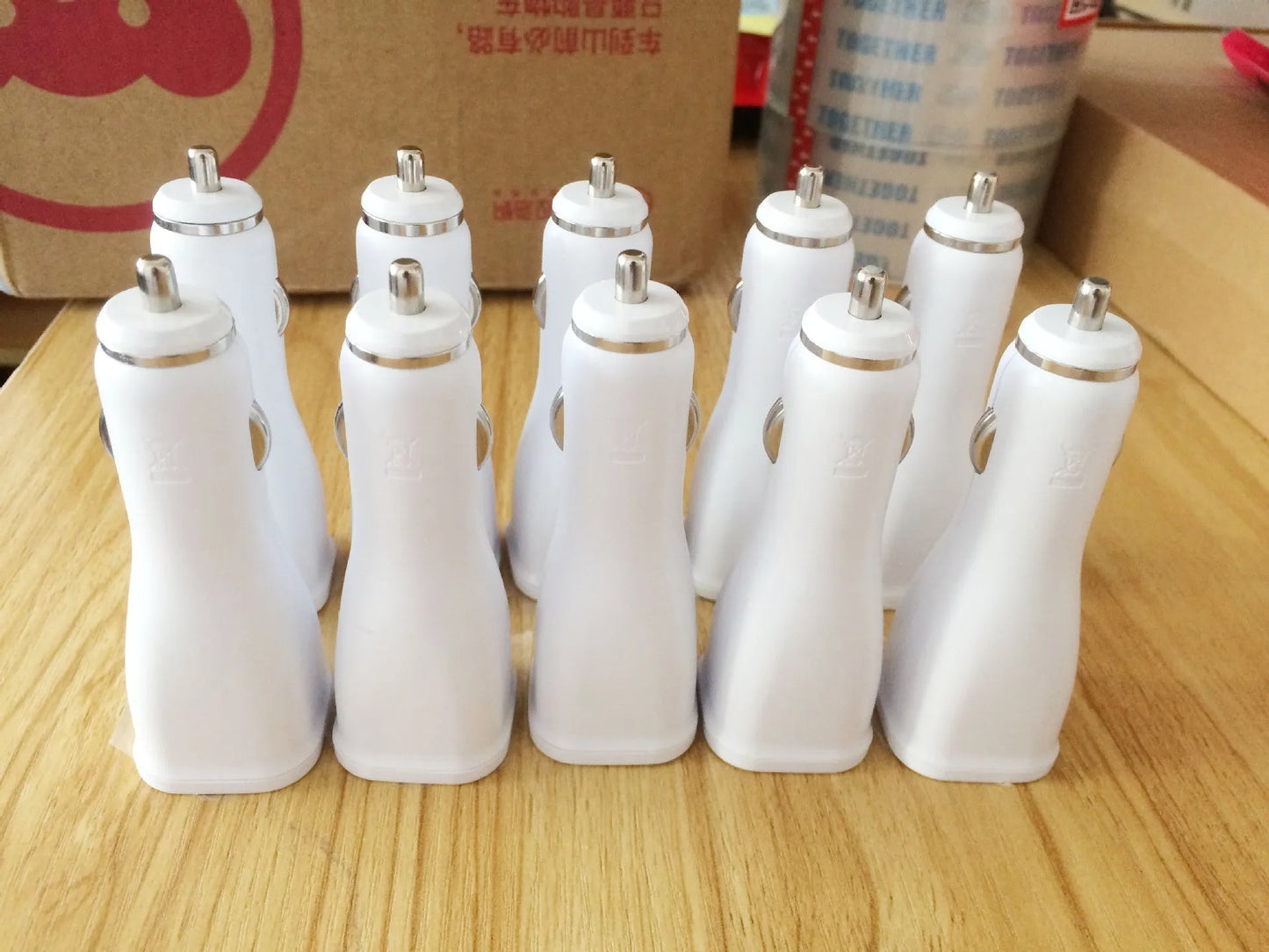 White single-port QC2.0 USB car fast charger for vehicles with safety protections.