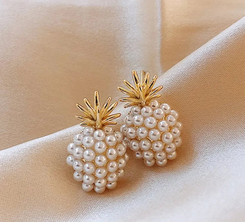 Korean style pineapple and starfish motif earrings with pearl accents in gold, silver, pearl flower, or starfish pearl finish.