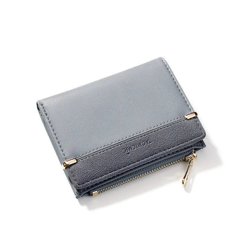 Multi card slot short zipper ladies wallet in 2-fold design with PU leather exterior showing internal compartments