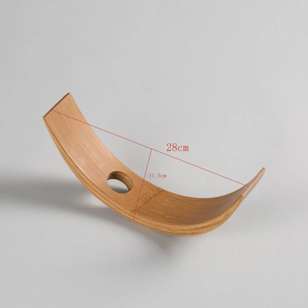 Natural bamboo wine bottle rack holding six bottles with wood grain visible