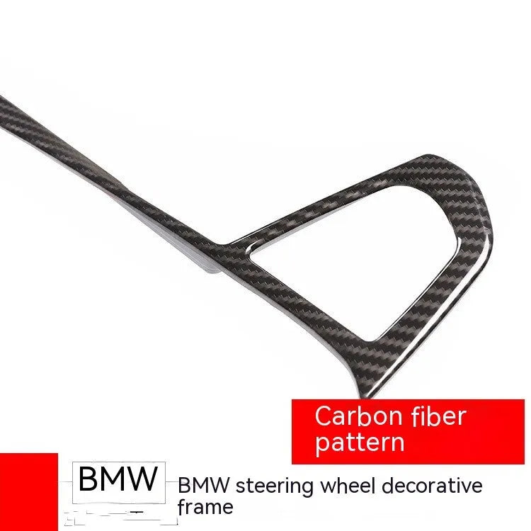 Carbon fibre pattern decorative button frame for BMW steering wheel.