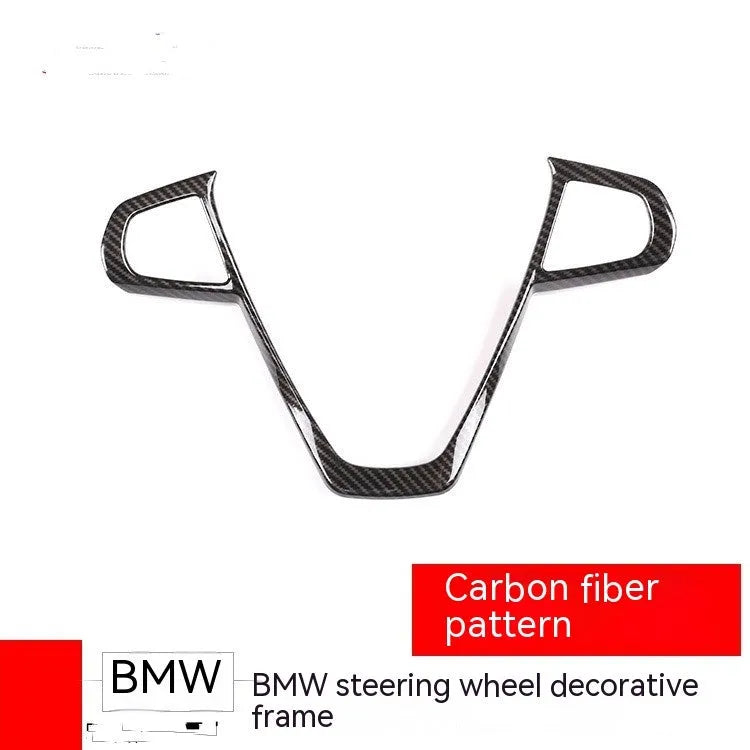 Carbon fibre pattern decorative button frame for BMW steering wheel.