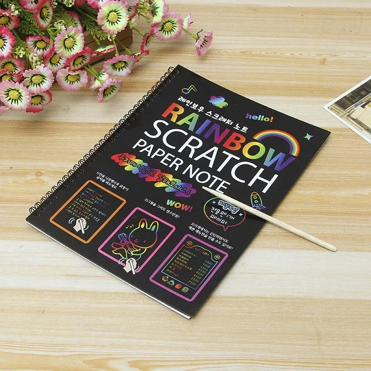 Children's large scratch art paper showing colourful patterns revealed through scraping