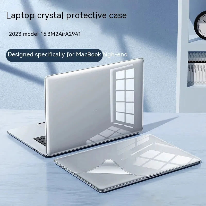 MacBook protective case in crystal transparent and frosted black finishes on a laptop.