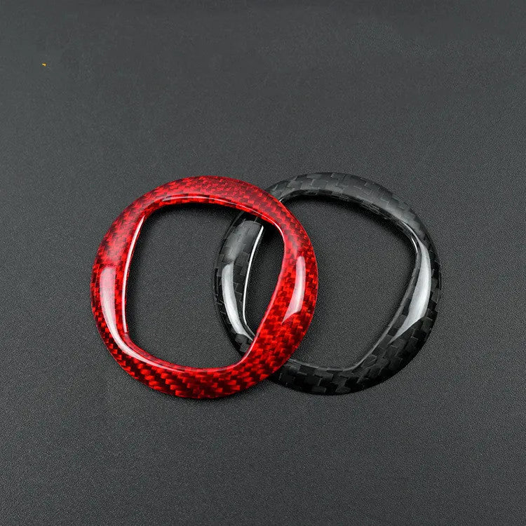 Carbon fiber steering wheel cover shown in black and red colour options for vehicle interior enhancement
