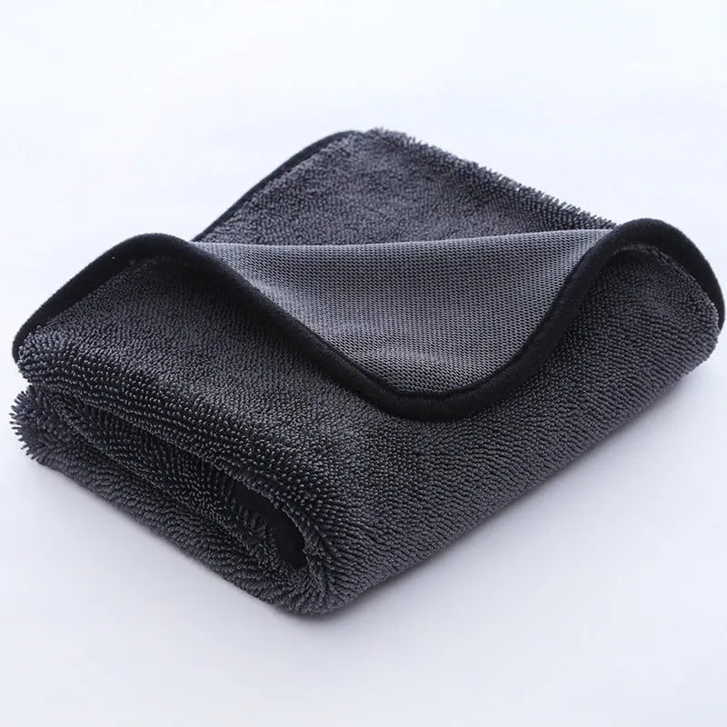 Grey car wash towel with black hemmed edge shown in multiple size options for vehicle cleaning
