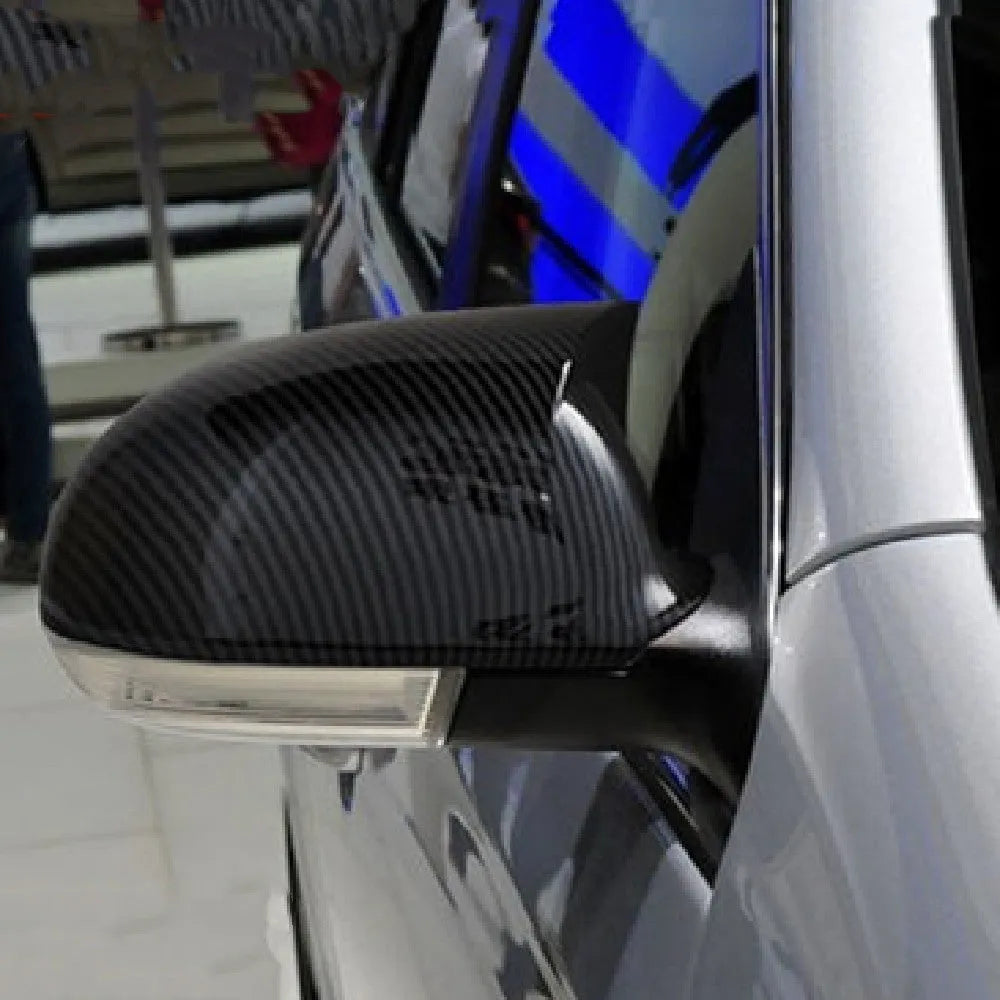 Pair of Horn Bright Black plastic outer reflector shells for Volkswagen Sagitar 2006-2011.