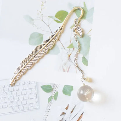 Dried flower bookmark with alloy frame measuring 12cm by 2cm, showing preserved botanical specimens