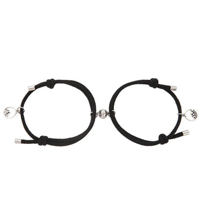 Magnetic couple's bracelet with geometric design and meaningful charms inspired by ancient Chinese tradition