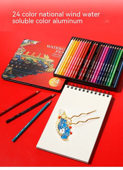 Metal tin box open to show 24 water-soluble coloured pencils with brush tips in assorted colours.