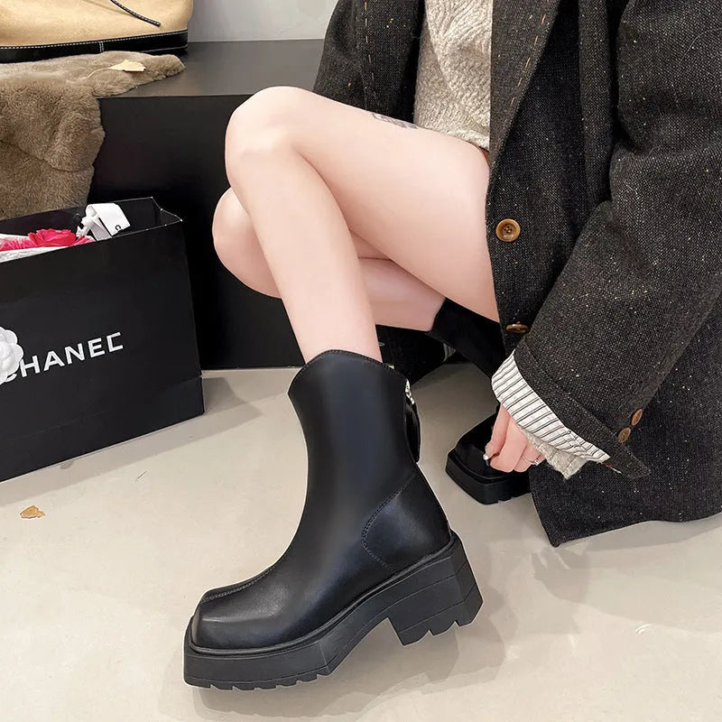 Black platform Martin boots for women with square toe, back zipper, and rubber sole.