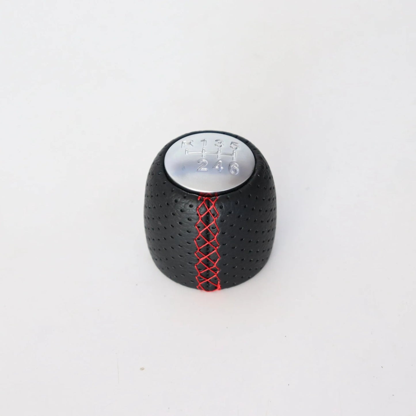 Sewn wrapped leather perforated style handball gear knob for Alpha vehicles in black, red, and white colour options.